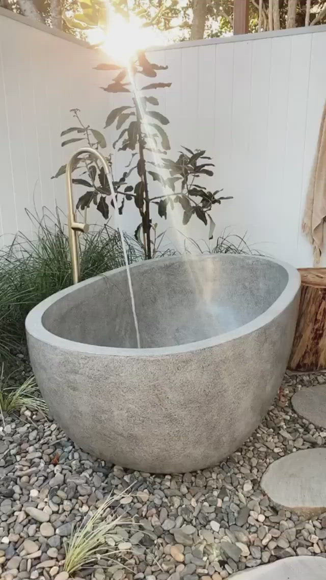 Video showcasing a handcrafted natural stone freestanding bath from Paradise Living Co.